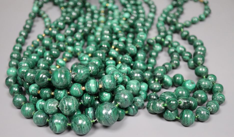 Ten assorted single strand malachite bead necklaces, two with gilt metal spacers, largest 64cm.